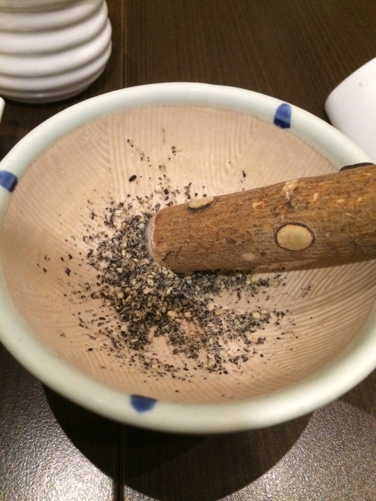 Crushing the sesame seeds for the tonkatsu sauce