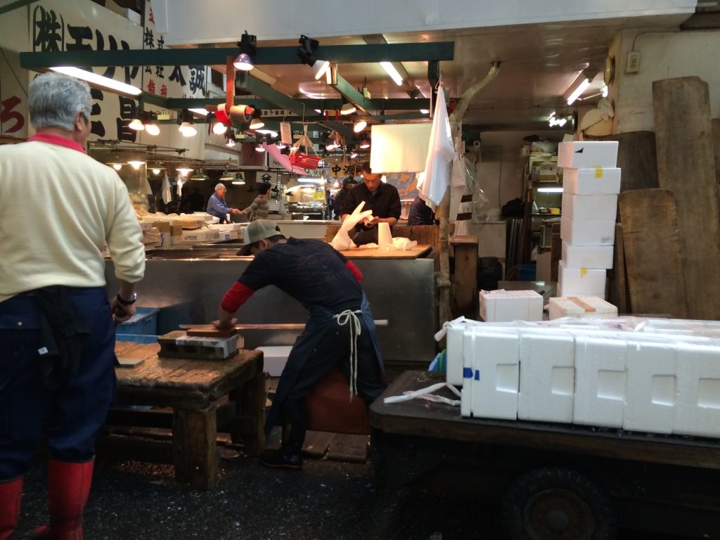 A guy sharpening his huge knife. We went around the market once and came back and he was still sharpening and then testing to see it was sharp enough.