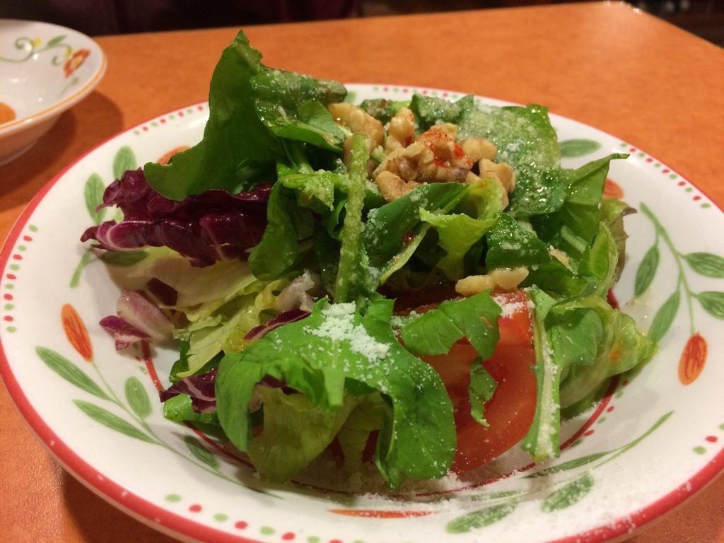 Side salad with walnuts. Italian dressing with parmesan 