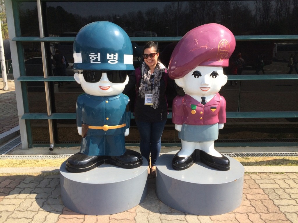 Posing with cartoon Korean military personnel 