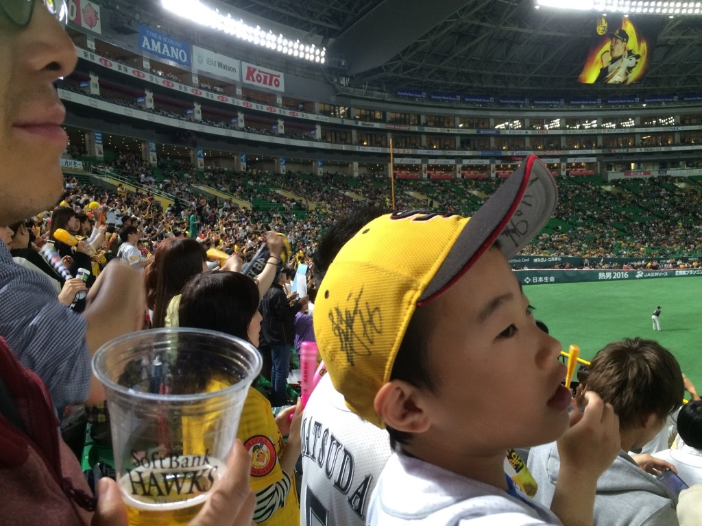 Tim made friends with the boy infront of him. Every time the Hawks scored, he would turn around and high five everyone (except me)