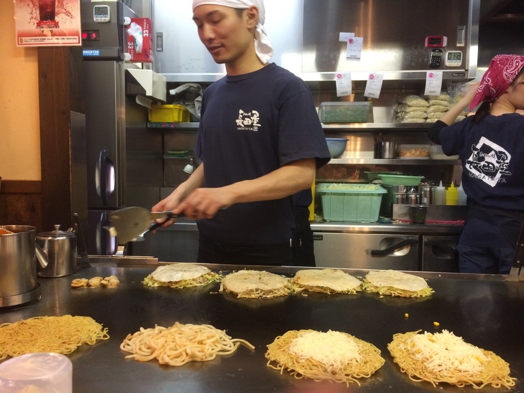 Hiroshima okonomiyaki is different than Osaka's because each part is a layer instead of being mixed in the batter