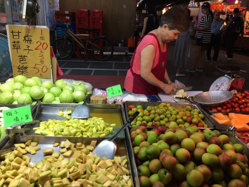 Our fruit lady at Linjiang Tonghua. Cut guava for 20 NT = $0.79 CAD