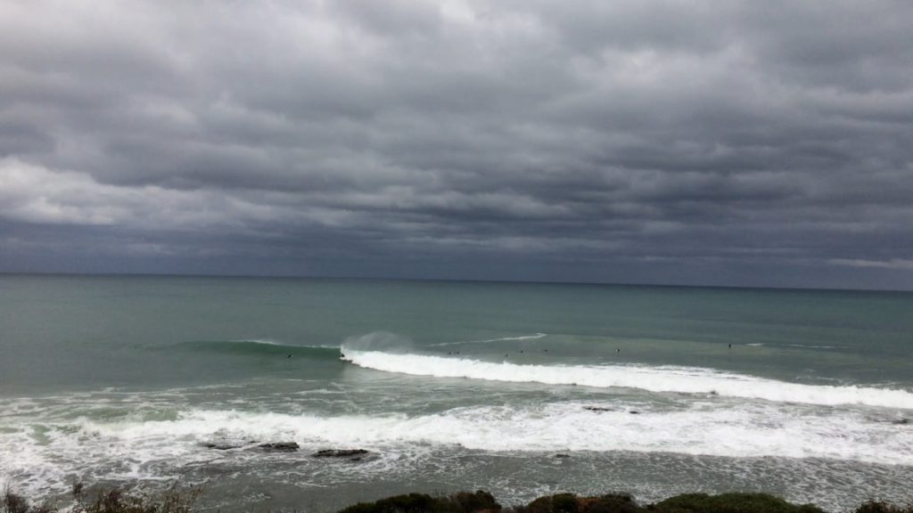 Those small black dots are all surfers. We stayed and watched them for a while. They're all very good. 