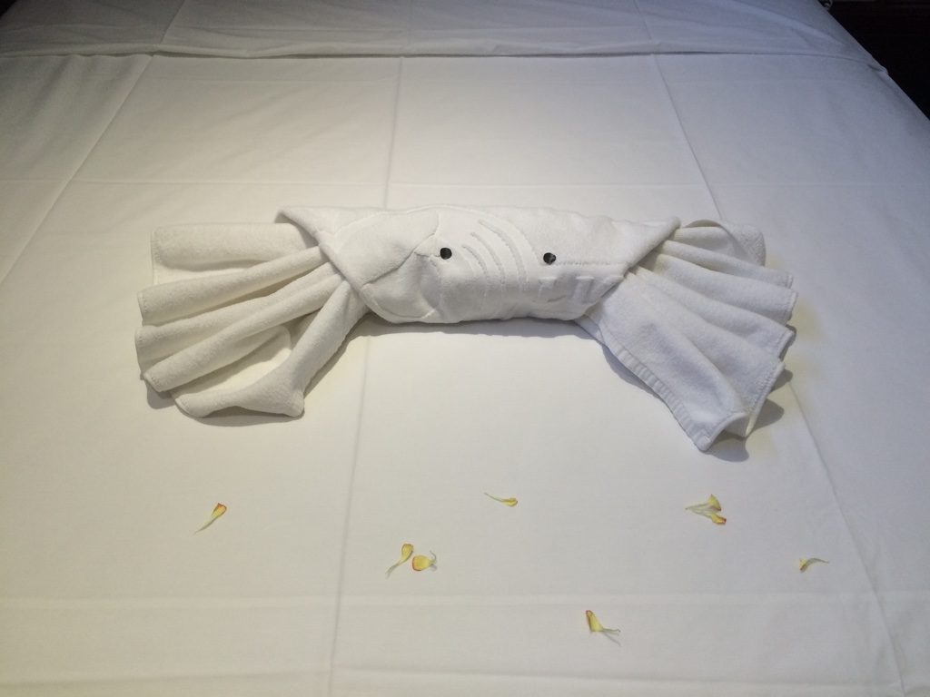A crab towel on our bed 