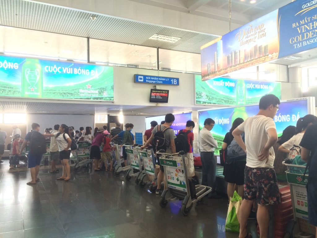 Waiting for our bags in Hanoi