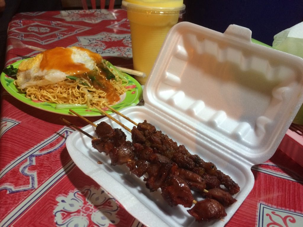 Our street dinner for $4 USD. Noodles and mango shake were $1 USD each and the skewers were $0.50 USD each