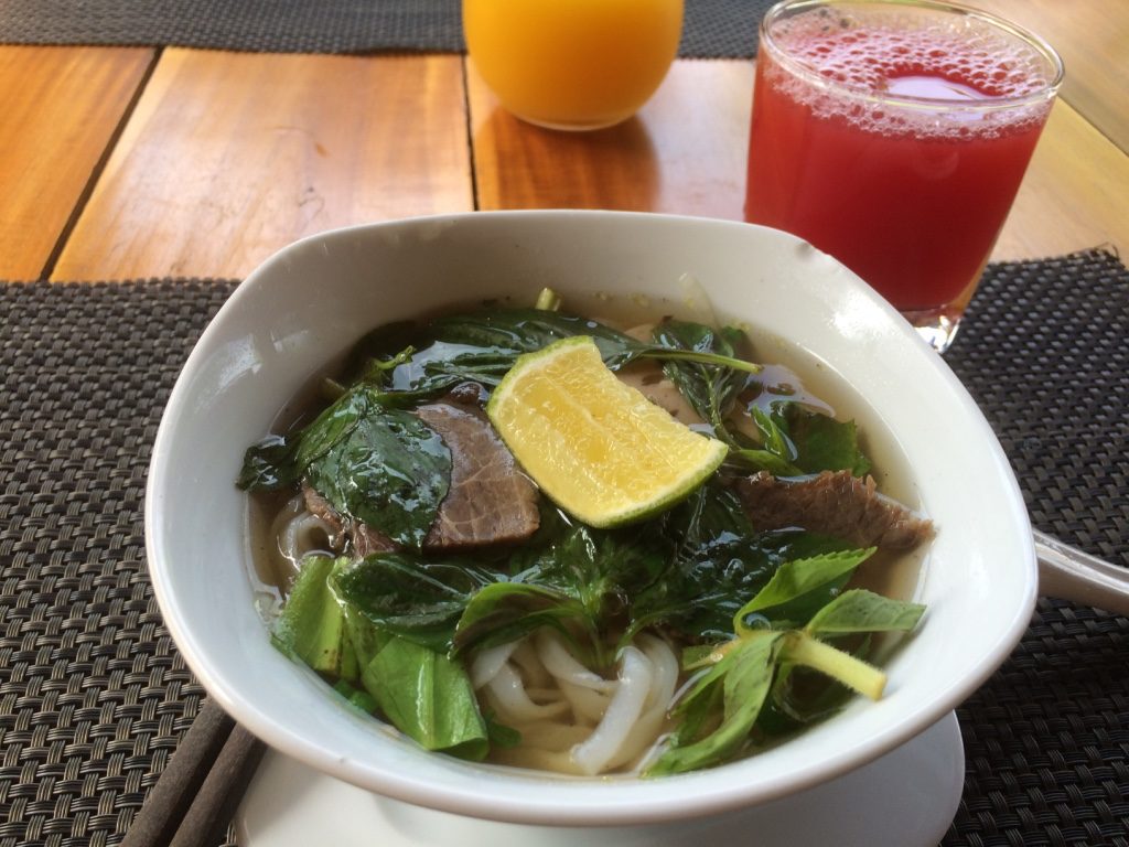 Fresh made pho bo (beef) for breakfast with freshly squeezed watermelon juice